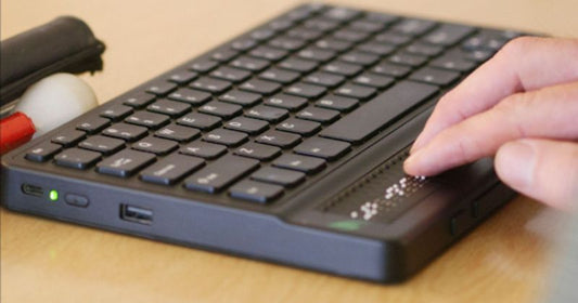 A close-up of a Braille for computer designed for visually impaired users, featuring raised tactile dots for efficient typing. 