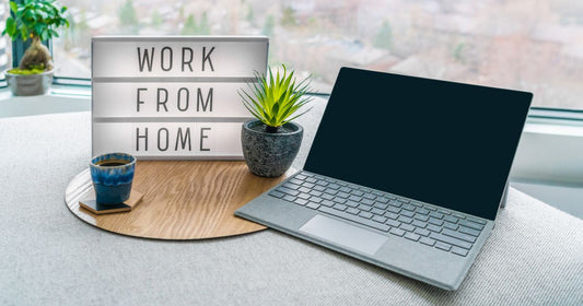 A desktop and a display saying: work from home