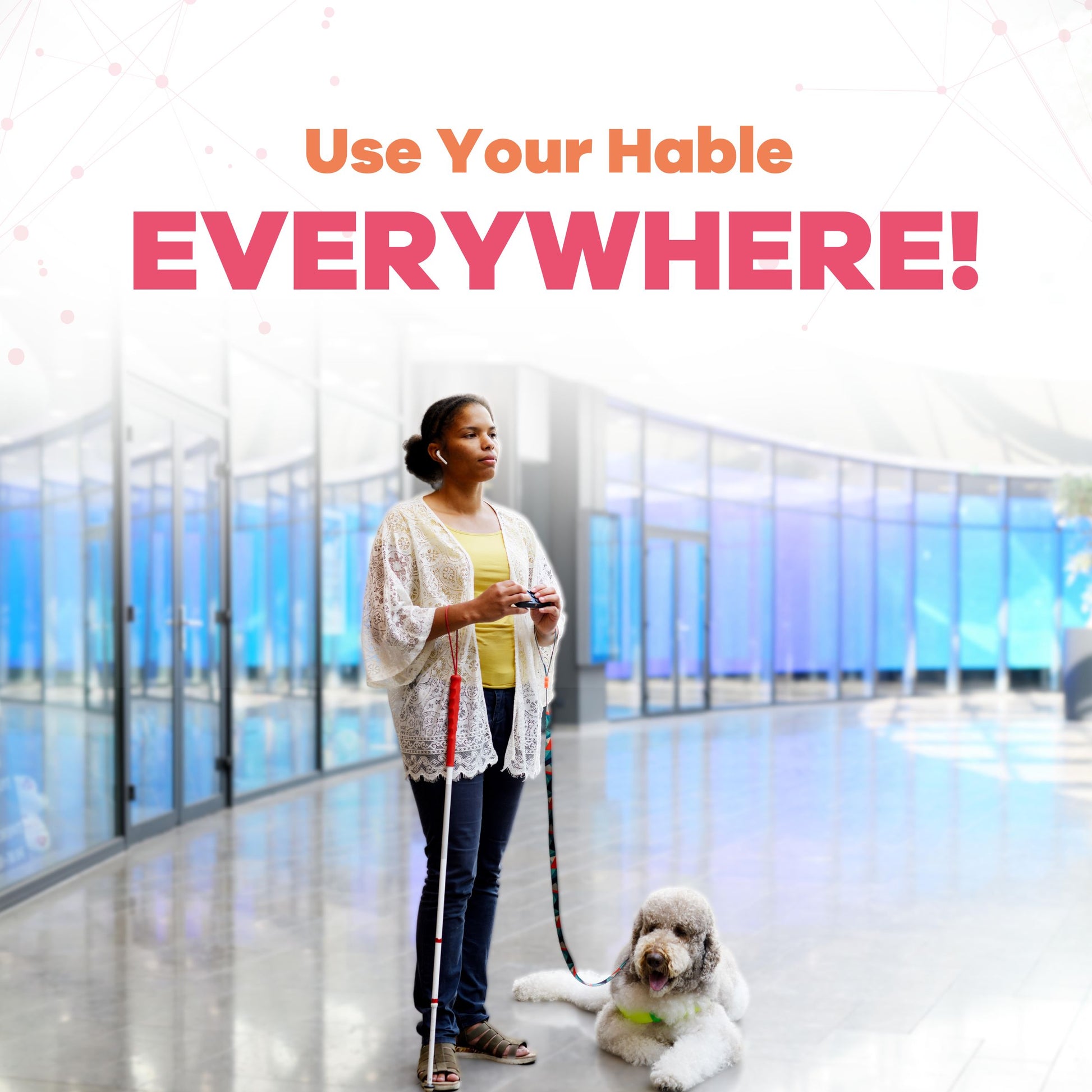 The image shows a blind woman standing in a modern indoor space, holding a Hable One Braille keyboard in her hands. She also has a white cane for navigation, and a guide dog, a fluffy poodle, sits calmly at her feet. The text above her reads, "Use Your Hable EVERYWHERE!" indicating the device's versatility.